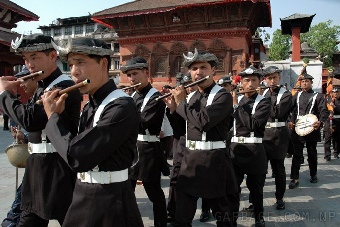 Gurju ko paltan marches, playing their instrument and heading the way for Machindranath's chariot.